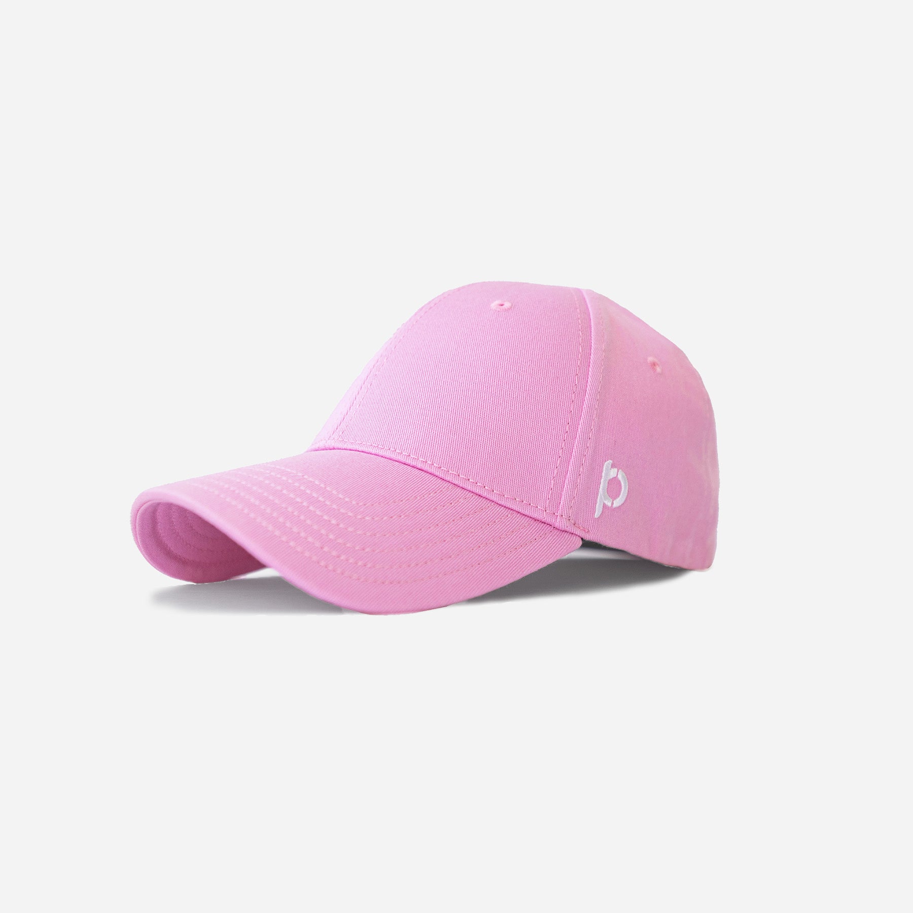 Pink baseball cap with a curved brim and a white logo embroidered on the side, isolated on a white background.