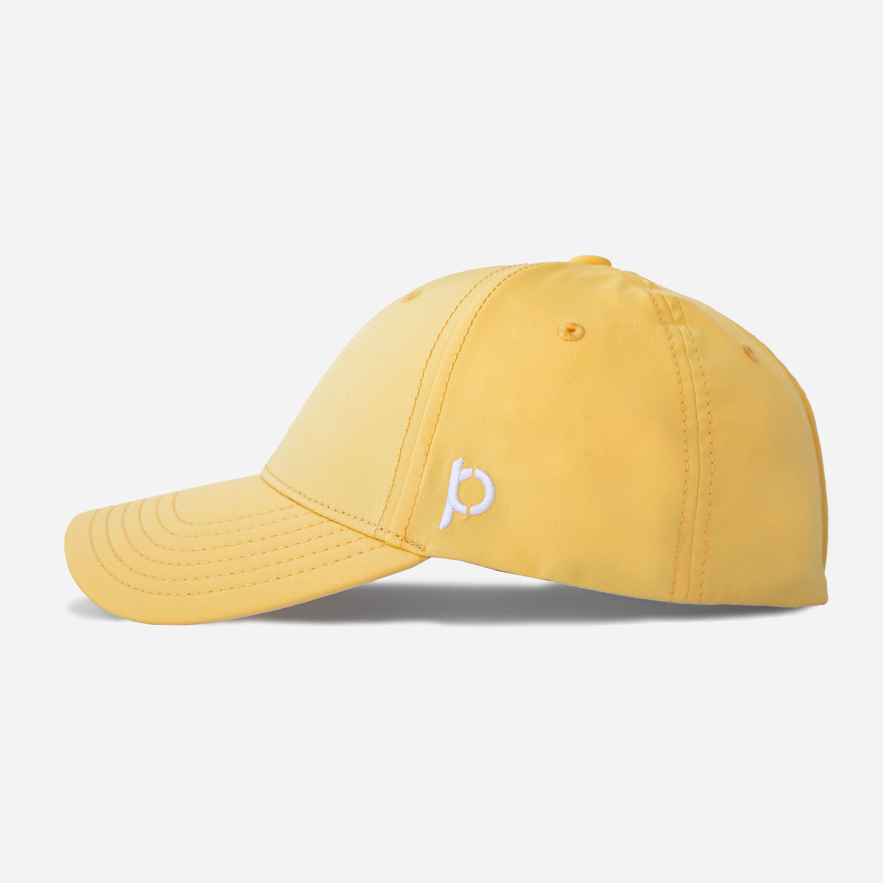 Yellow Adventure Fit baseball cap with a pineapple logo on the front.