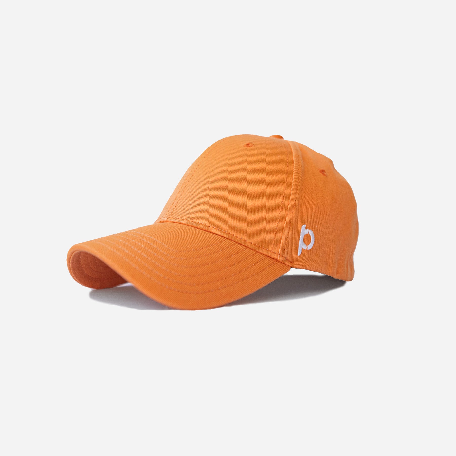 Bright apricot-colored baseball cap with a curved bill and embroidered logo on the side, displayed on a white background.