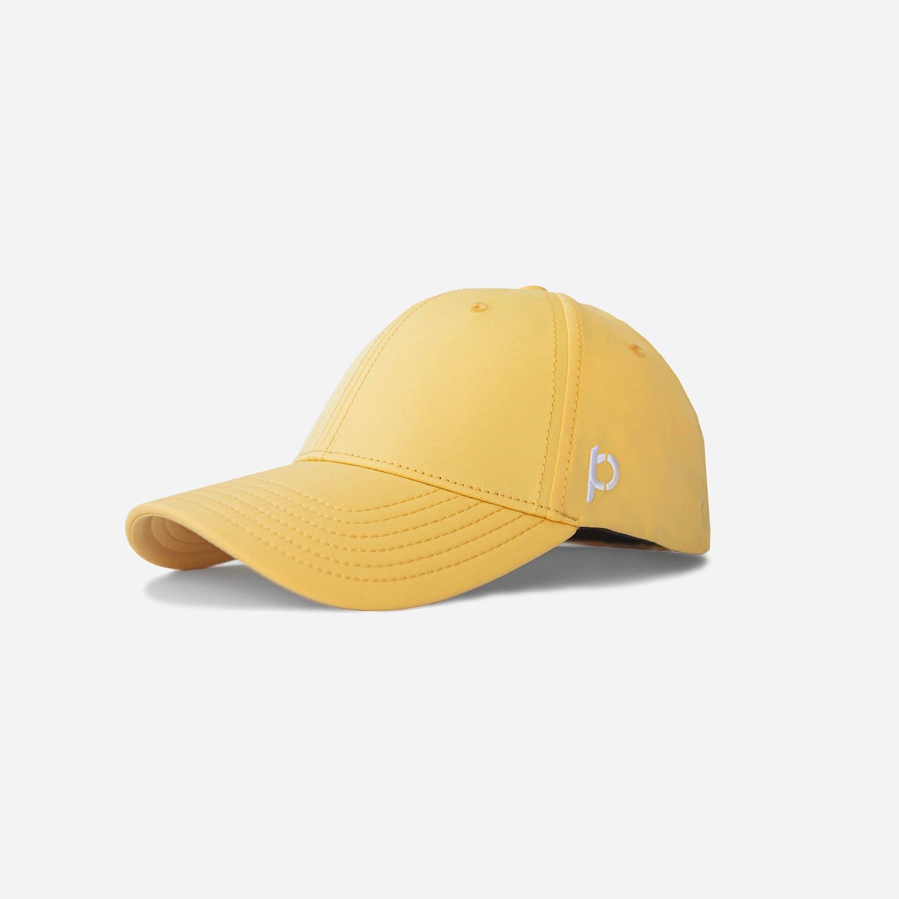 Yellow Adventure Fit baseball cap with a white pineapple logo embroidered on the side.